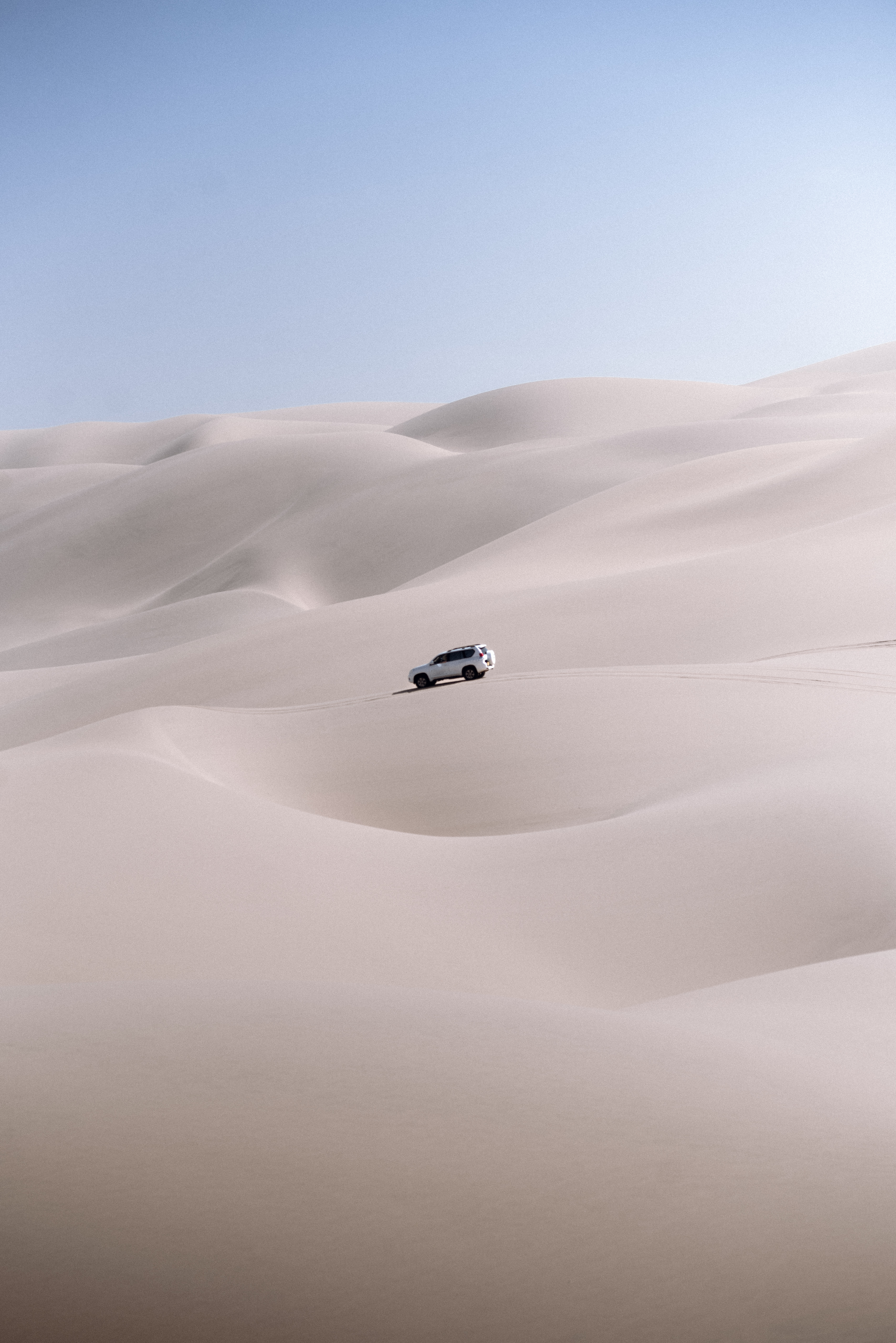 Panoramic view of the dunes of Sandwich Harbour falling into the ocean